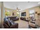 Relaxing living room featuring a large sectional sofa and flat-screen TV at 8315 Round Leaf Ln, Riverview, FL 33578