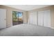 Bright bedroom with balcony access and ample closet space at 9386 Tradewinds Ave, Seminole, FL 33776