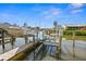 Private boat dock with lift and walkway at 9386 Tradewinds Ave, Seminole, FL 33776