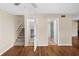 Hallway with stairs leading upstairs and doors to bathroom and closet at 9386 Tradewinds Ave, Seminole, FL 33776