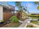 Side yard with walkway to the canal at 9386 Tradewinds Ave, Seminole, FL 33776