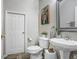 Clean bathroom with white vanity, toilet and decorative accents at 9418 W Park Village Dr # 105, Tampa, FL 33626