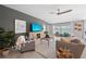Living room with gray sofa, wooden coffee table, and view of water at 108 Lilyan Ct, Rotonda West, FL 33947