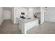 Modern kitchen with island and stainless steel appliances at 110 Lilyan Ct, Rotonda West, FL 33947
