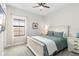 Cozy bedroom with neutral colors, a white bed frame, and soft carpet at 14672 Horse Trot Rd, Lithia, FL 33547