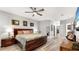 Cozy bedroom featuring wood-look floors, neutral walls, and a ceiling fan at 1957 Whitney Oaks Blvd, Clearwater, FL 33760