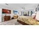 Bright bedroom featuring wood-look floors, neutral walls, and a ceiling fan at 1957 Whitney Oaks Blvd, Clearwater, FL 33760