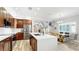 Open-concept kitchen features a large island, stainless steel appliances, and an adjacent dining area at 1957 Whitney Oaks Blvd, Clearwater, FL 33760