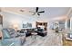 Spacious living room featuring an open floor plan, modern furnishings, and stylish tile flooring at 1957 Whitney Oaks Blvd, Clearwater, FL 33760