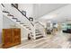 Bright living room with a staircase, modern furniture, and hardwood floors at 1957 Whitney Oaks Blvd, Clearwater, FL 33760