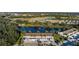 Aerial view of community with lake and condo buildings at 201 Silver Lake Dr # 204, Venice, FL 34292