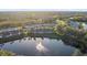 Aerial view of a community with lakefront houses at 201 Silver Lake Dr # 204, Venice, FL 34292