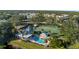 Aerial view of community pool, tennis and pickleball courts at 201 Silver Lake Dr # 204, Venice, FL 34292