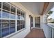 View from the balcony features large windows, stucco siding, and white railings at 201 Silver Lake Dr # 204, Venice, FL 34292