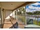 The screened-in lanai features a serene view of the lake, providing a tranquil outdoor space at 201 Silver Lake Dr # 204, Venice, FL 34292