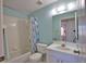 Bright bathroom with shower and tub combo, neutral tile, and modern fixtures at 201 Silver Lake Dr # 204, Venice, FL 34292