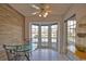 Bright breakfast nook features tile flooring, a ceiling fan, and a charming bay window with views at 201 Silver Lake Dr # 204, Venice, FL 34292