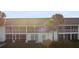 Condo building exterior with palm trees and grassy lawn at 201 Silver Lake Dr # 204, Venice, FL 34292