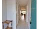 Hallway from front door to living area with a view of ceiling fan at 201 Silver Lake Dr # 204, Venice, FL 34292