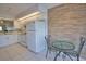 Kitchen featuring modern appliances, tile flooring, white cabinets, and adjacent breakfast nook at 201 Silver Lake Dr # 204, Venice, FL 34292