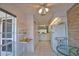 Kitchen with white cabinets, tile flooring, breakfast nook and a pass through to the kitchen sink at 201 Silver Lake Dr # 204, Venice, FL 34292