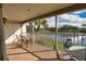 Enjoy the lake view from the screened porch with outdoor seating and palm trees at 201 Silver Lake Dr # 204, Venice, FL 34292