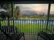 Relaxing screened porch overlooking a pond with fountain at 201 Silver Lake Dr # 204, Venice, FL 34292