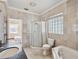 Bathroom with a shower, bathtub, and granite countertop at 2201 30Th N Ave, St Petersburg, FL 33713