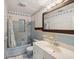 Blue tiled bathroom with shower/tub combo and vanity at 2201 30Th N Ave, St Petersburg, FL 33713