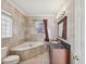 Bathroom features a corner jacuzzi tub and granite vanity at 2201 30Th N Ave, St Petersburg, FL 33713