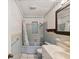 Bathroom with blue tile, shower/tub combo, and vanity at 2201 30Th N Ave, St Petersburg, FL 33713