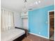 Light blue walls, hardwood floor, and a double bed in this bedroom at 2201 30Th N Ave, St Petersburg, FL 33713