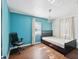 Small bedroom with teal walls, hardwood floors, and a double bed at 2201 30Th N Ave, St Petersburg, FL 33713