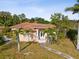 One-story house with a terracotta roof and a landscaped yard at 2201 30Th N Ave, St Petersburg, FL 33713