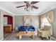 Living room with blue sofa and beige armchair at 2201 30Th N Ave, St Petersburg, FL 33713