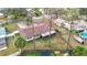 Aerial view showcasing home and backyard with a screened patio at 23315 Charlston Pl, Land O Lakes, FL 34639