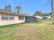 View of backyard, home exterior and patio at 23315 Charlston Pl, Land O Lakes, FL 34639