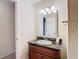 Bathroom with granite vanity and updated fixtures at 23315 Charlston Pl, Land O Lakes, FL 34639