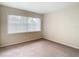 Bedroom with large window and carpet at 23315 Charlston Pl, Land O Lakes, FL 34639