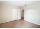 Simple bedroom with neutral carpeting and double door closet at 23315 Charlston Pl, Land O Lakes, FL 34639