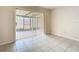 Bright Gathering room featuring sliding glass doors leading to a screened patio at 23315 Charlston Pl, Land O Lakes, FL 34639