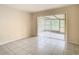 Spacious Gathering room with sliding doors leading to a screened patio at 23315 Charlston Pl, Land O Lakes, FL 34639