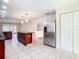 Spacious kitchen with stainless steel appliances and dark wood cabinets at 23315 Charlston Pl, Land O Lakes, FL 34639