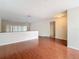 Living room with hardwood floors and access to hallway at 23315 Charlston Pl, Land O Lakes, FL 34639