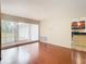 Living room with hardwood floors and sliding glass doors to backyard at 23315 Charlston Pl, Land O Lakes, FL 34639