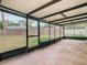 Screened patio and grassy backyard at 23315 Charlston Pl, Land O Lakes, FL 34639