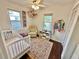 bedroom with crib, dresser, and whimsical decor at 3409 Tarlton N St, St Petersburg, FL 33713