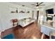 Spacious living room with hardwood floors, built-in shelves, and a fireplace at 3409 Tarlton N St, St Petersburg, FL 33713