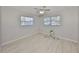 Light-filled bedroom with wood-look floors and neutral color scheme at 4116 Ohio Ave, Tampa, FL 33616
