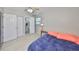 Well-lit bedroom features wood-look floors and a connected en-suite bathroom at 4116 Ohio Ave, Tampa, FL 33616